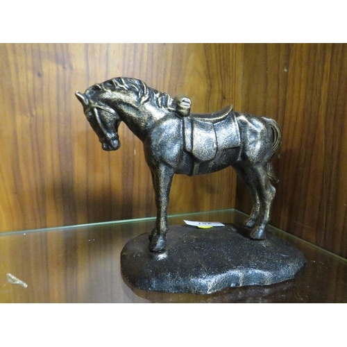 257 - A CAST METAL FIGURE OF A HORSE