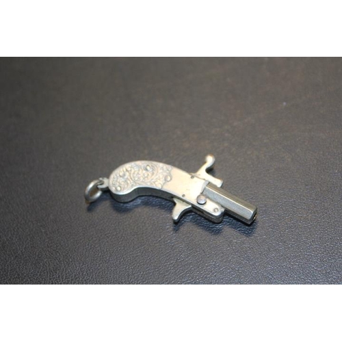 394 - A VINTAGE MINIATURE WHITE METAL PISTOL