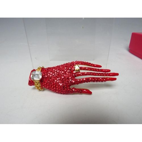 423 - A BUTLER & WILSON RED HAND BROOCH TOGETHER WITH A PAIR OF MATCHED EARRINGS, BOXED, (2)