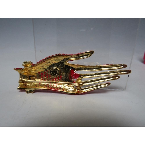 423 - A BUTLER & WILSON RED HAND BROOCH TOGETHER WITH A PAIR OF MATCHED EARRINGS, BOXED, (2)