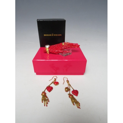 423 - A BUTLER & WILSON RED HAND BROOCH TOGETHER WITH A PAIR OF MATCHED EARRINGS, BOXED, (2)