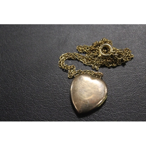 401 - AN ANTIQUE LOCKET MARKED 9CT BACK AND FRONT