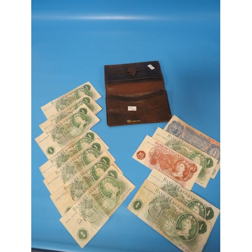 457 - A WALLET OF £1 POUND AND 10 SHILLING BANKNOTES, INCLUDING A BLUE WORLD WAR 2 ISSUE