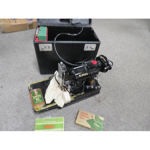 134 - A CASED ELECTRIC 222K SINGER SEWING MACHINE COMPLETE WITH INSTRUCTION BOOK, ACCESSORIES TO INCLUDE A... 