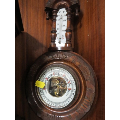 206 - A VINTAGE MAHOGANY MANTLE CLOCK TOGETHER WITH AN ORNATE WALL MOUNTED BAROMETER