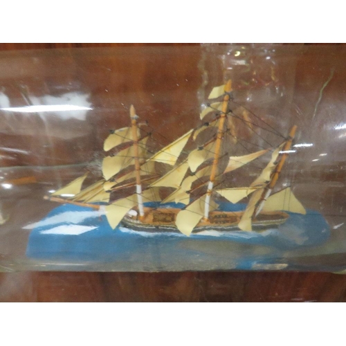 207 - A VINTAGE MODEL OF A YACHT ON STAND TOGETHER WITH TWO SHIPS IN A BOTTLE