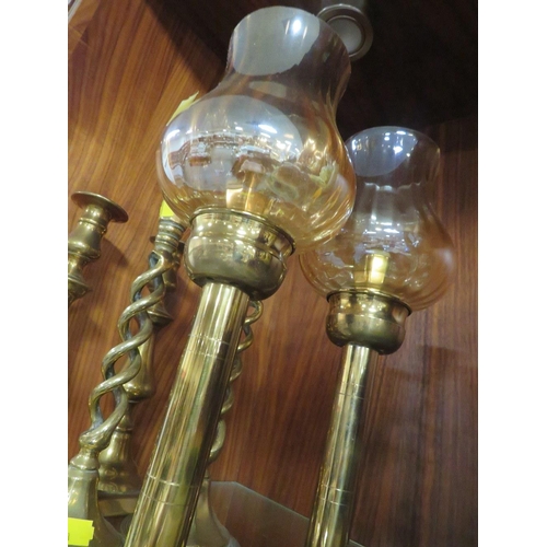 210 - THREE PAIRS OF BRASS CANDLESTICKS