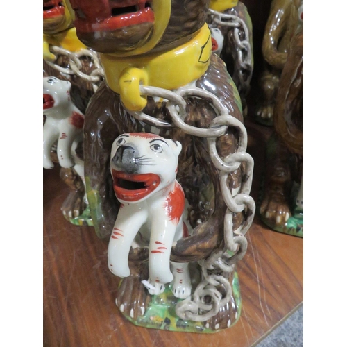 218 - SIX REPRODUCTION NOVELTY JUGS IN THE FORM OF A CAGE BEAR HOLDING A FELINE 