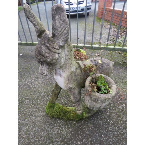 635 - A CONCRETE PLANTER STATUE DEPICTING A DONKEY