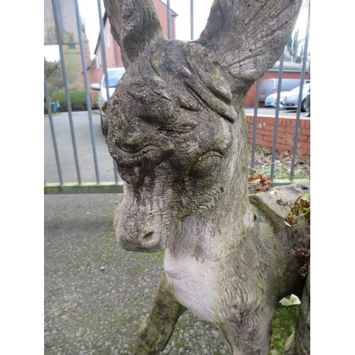 635 - A CONCRETE PLANTER STATUE DEPICTING A DONKEY