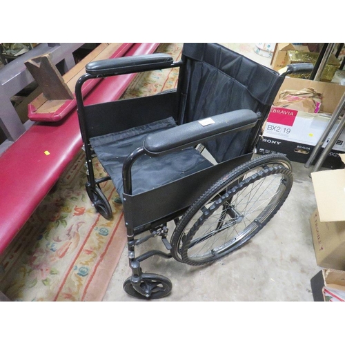 666 - A FOLD AWAY WHEELCHAIR WITH SOLID TYRES AND HANDRAIL