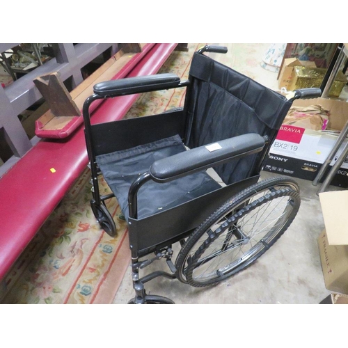 666 - A FOLD AWAY WHEELCHAIR WITH SOLID TYRES AND HANDRAIL