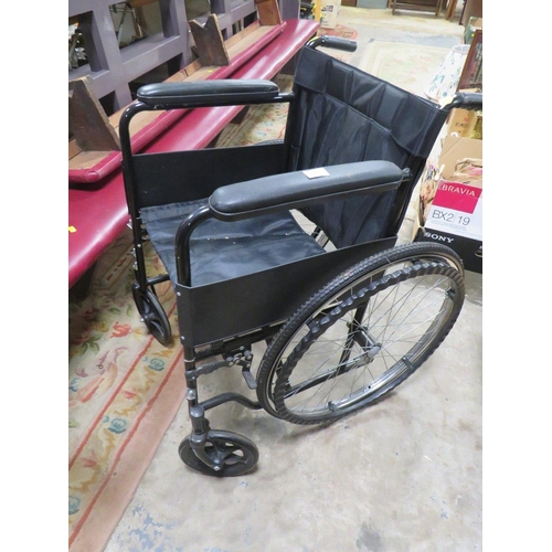 666 - A FOLD AWAY WHEELCHAIR WITH SOLID TYRES AND HANDRAIL