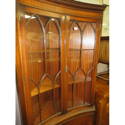 706 - A REPRODUCTION MAHOGANY CONCAVE GLAZED CORNER CABINET H-188 CM W-92 CM