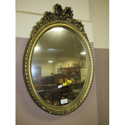 710 - AN OVAL MIRROR AND A RECTANGULAR MIRROR (2)