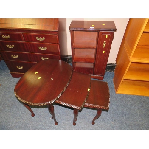 714 - A REPRODUCTION MAHOGANY CABINET AND NEST OF TABLES