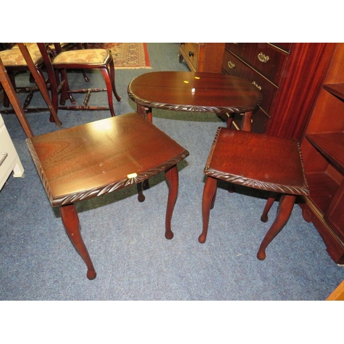 714 - A REPRODUCTION MAHOGANY CABINET AND NEST OF TABLES