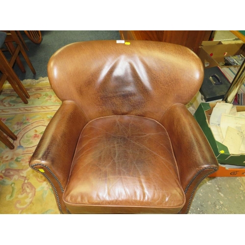 736 - A REPRODUCTION CLUB STYLE ARMCHAIR