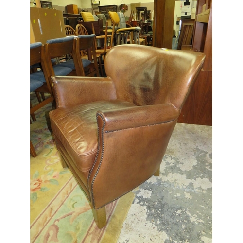 736 - A REPRODUCTION CLUB STYLE ARMCHAIR