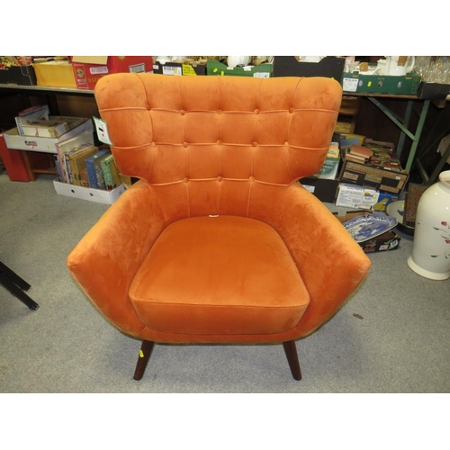 738 - A MODERN BURNT ORANGE UPHOLSTERED ARMCHAIR