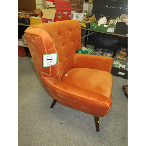 738 - A MODERN BURNT ORANGE UPHOLSTERED ARMCHAIR