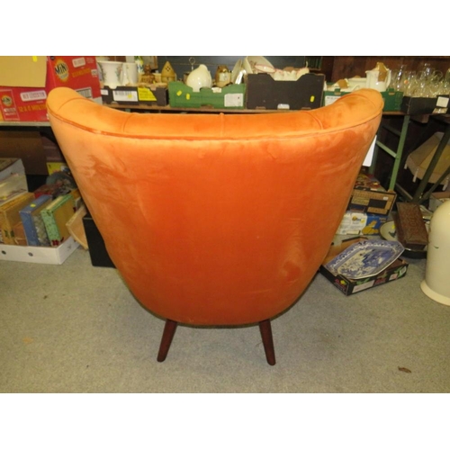 738 - A MODERN BURNT ORANGE UPHOLSTERED ARMCHAIR