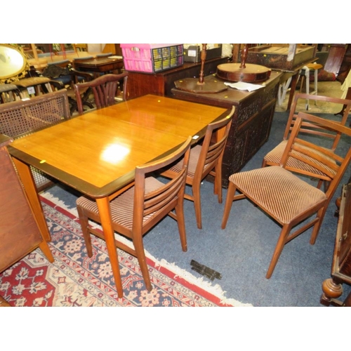 745 - A MID-CENTURY EXTENDING GIMSON & SLATER LTD VESPER DINING TABLE & FOUR CHAIRS