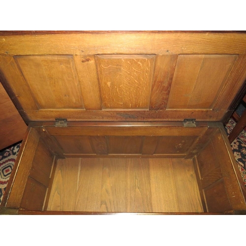 748 - A SMALL OAK CARVED PANELLED COFFER - W 90 cm