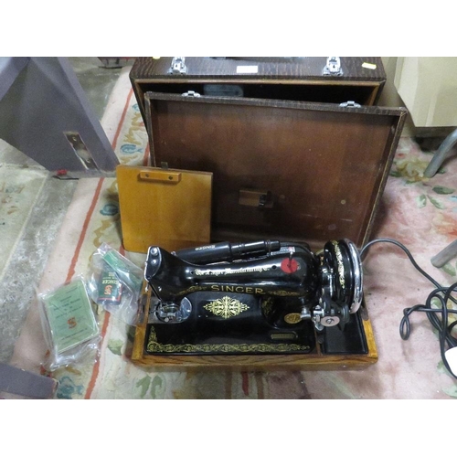 76 - A CASED VINTAGE ELECTRIC SINGER SEWING MACHINE EC142854