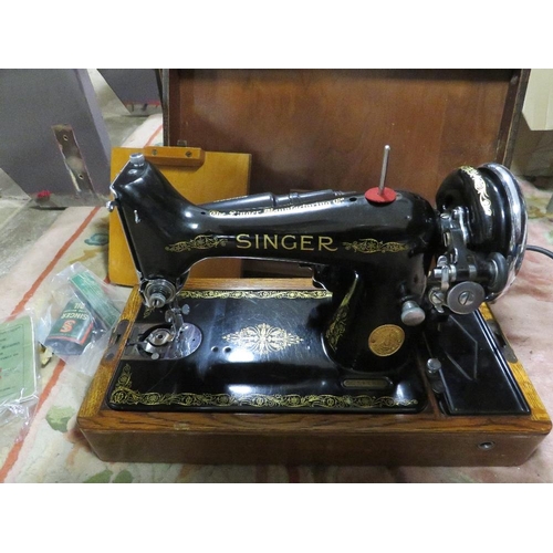 76 - A CASED VINTAGE ELECTRIC SINGER SEWING MACHINE EC142854