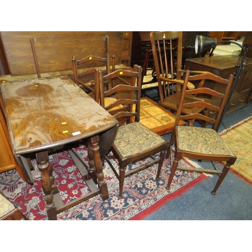 760 - AN OAK DROPLEAF TABLE AND FOUR CHAIRS