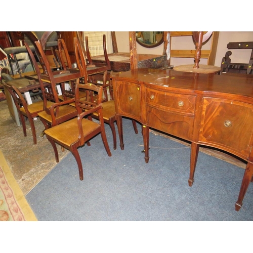 765 - A REPRODUCTION MAHOGANY SHAPED SIDEBOARD WITH A TWIN PEDESTAL TABLE AND EIGHT CHAIRS