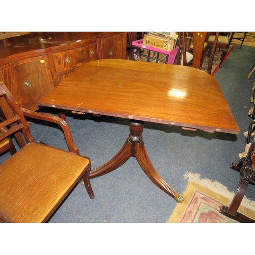 765 - A REPRODUCTION MAHOGANY SHAPED SIDEBOARD WITH A TWIN PEDESTAL TABLE AND EIGHT CHAIRS