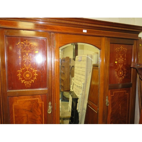 770 - AN ANTIQUE MAHOGANY INLAID TRIPLE WARDROBE WITH CENTRAL MIRROR DOOR