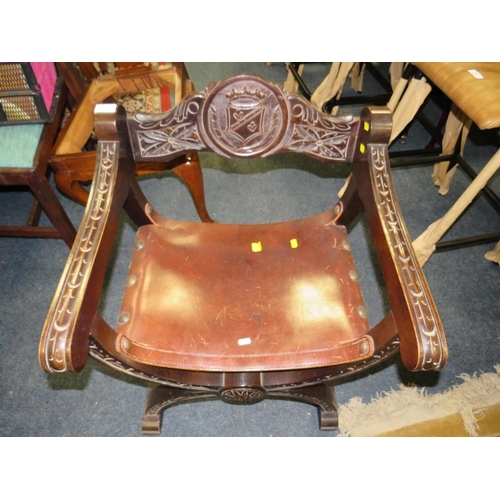 777 - A CARVED 'X-FRAME' CEREMONIAL ARMCHAIR