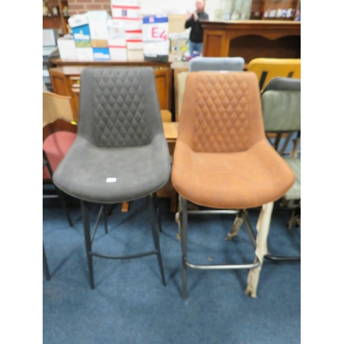 779 - A HARLEQUIN PAIR OF UPHOLSTERED BAR/KITCHEN STOOLS