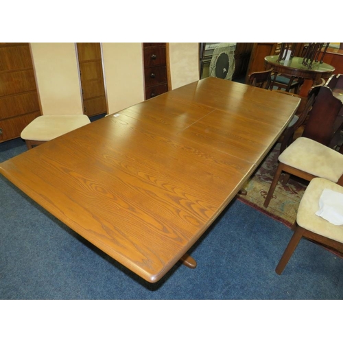 785 - A MODERN ERCOL DRAWLEAF DINING TABLE AND 6 CHAIRS