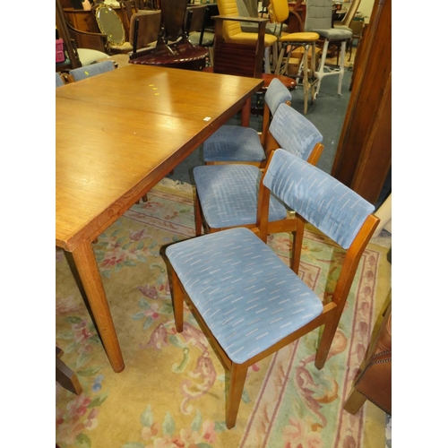 796 - A MID-CENTURY TEAK EXTENDING DINING TABLE AND 6 CHAIRS