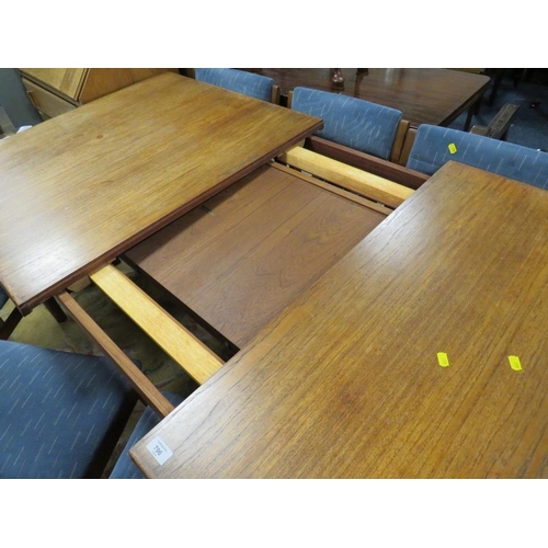 796 - A MID-CENTURY TEAK EXTENDING DINING TABLE AND 6 CHAIRS