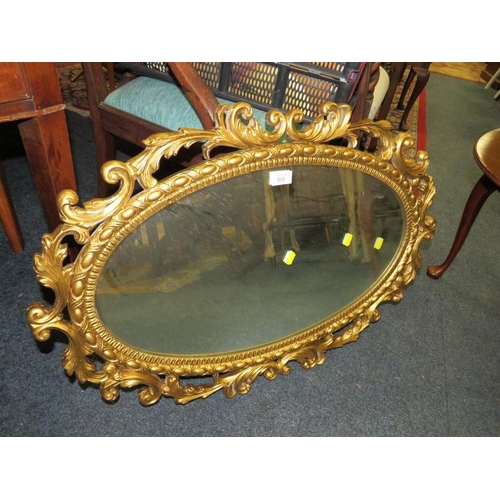 806 - A GILT OVAL MIRROR, ANTIQUE MAHOGANY MIRROR AND A SMALL TABLE (3)