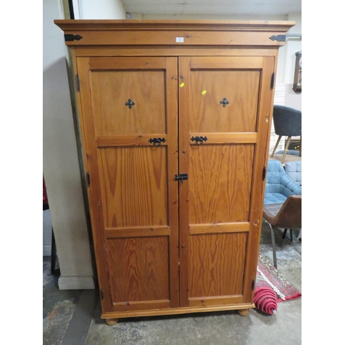 810 - A PITCH PINE TWO DOOR BOOKCASE