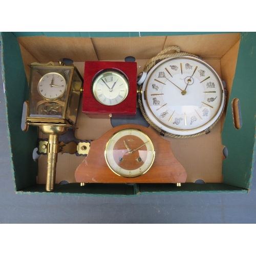 87 - A TRAY CONTAINING A KIENZLE ZODIAC WALL CLOCK, QUARTZ NAUTICAL CLOCK, MANTLE CLOCK AND A SHATZ BRACK... 