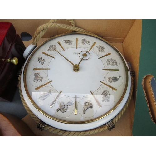 87 - A TRAY CONTAINING A KIENZLE ZODIAC WALL CLOCK, QUARTZ NAUTICAL CLOCK, MANTLE CLOCK AND A SHATZ BRACK... 