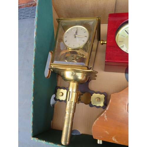 87 - A TRAY CONTAINING A KIENZLE ZODIAC WALL CLOCK, QUARTZ NAUTICAL CLOCK, MANTLE CLOCK AND A SHATZ BRACK... 