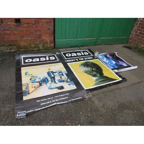 11 - TWO LARGE OASIS POSTERS TOGETHER WITH A SMALLER OASIS POSTER - LARGEST APPROX 152 X 101.5 CM