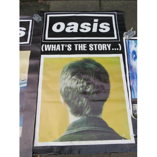 11 - TWO LARGE OASIS POSTERS TOGETHER WITH A SMALLER OASIS POSTER - LARGEST APPROX 152 X 101.5 CM