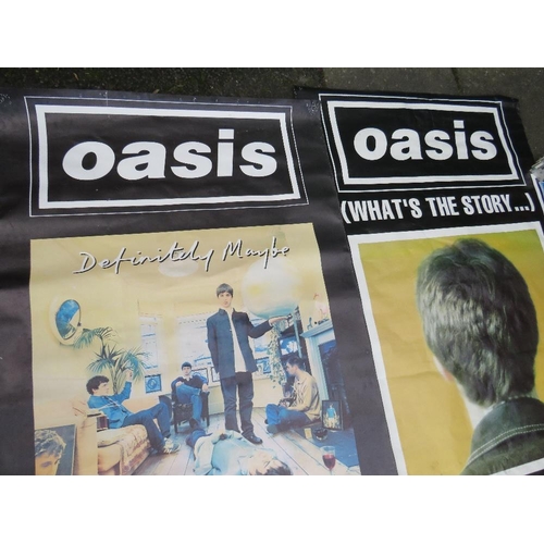 11 - TWO LARGE OASIS POSTERS TOGETHER WITH A SMALLER OASIS POSTER - LARGEST APPROX 152 X 101.5 CM