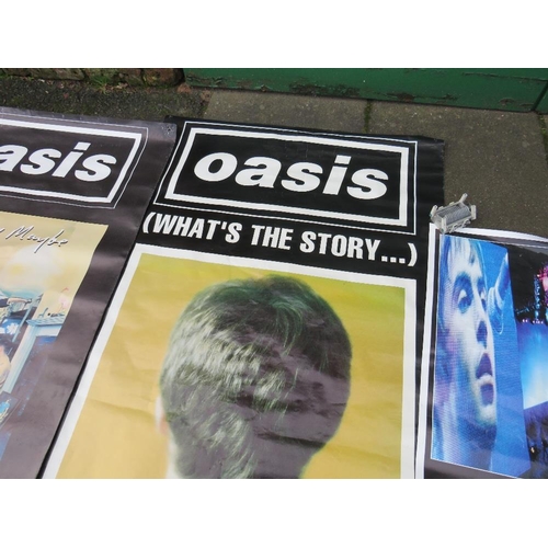 11 - TWO LARGE OASIS POSTERS TOGETHER WITH A SMALLER OASIS POSTER - LARGEST APPROX 152 X 101.5 CM