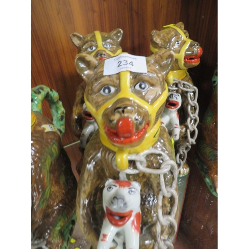 234 - FIVE REPRODUCTION NOVELTY JUGS IN THE FORM OF A CAGE BEAR HOLDING A FELINE 