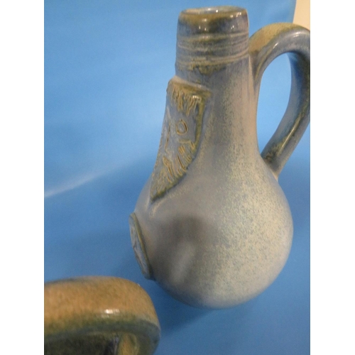 262 - TWO STUDIO POTTERY BELLARMINE STYLE JUGS THE TALLEST 23.5 CM